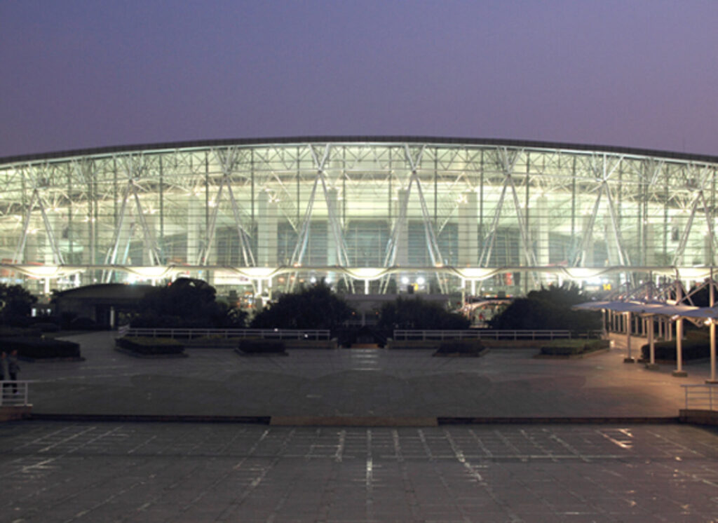 Hangzhou Xiaoshan International Airport terminal at night with curved facade